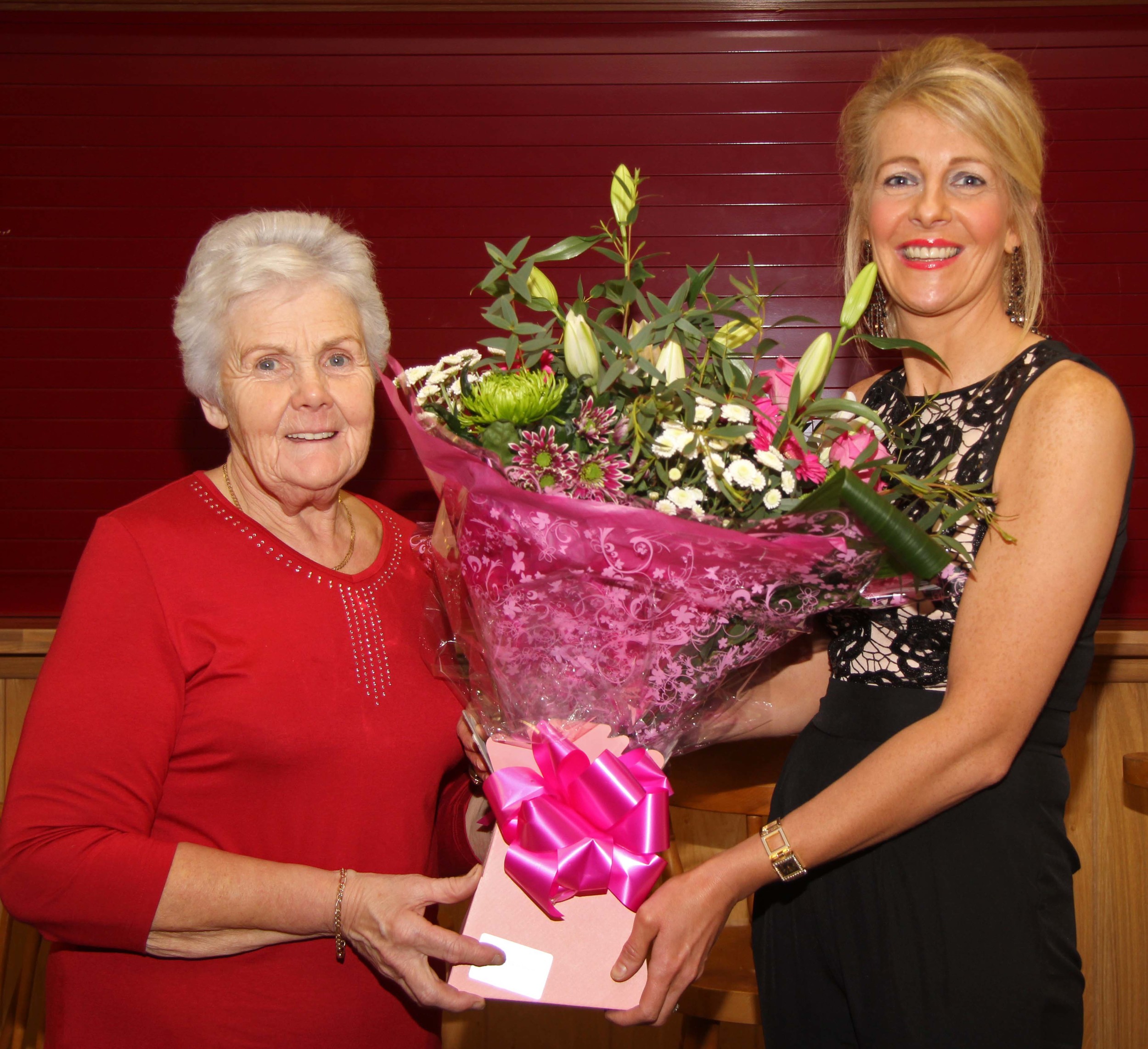 Committee member Thelma Gorman makes a presentation to the chairman's wife Sandra Rodgers. 