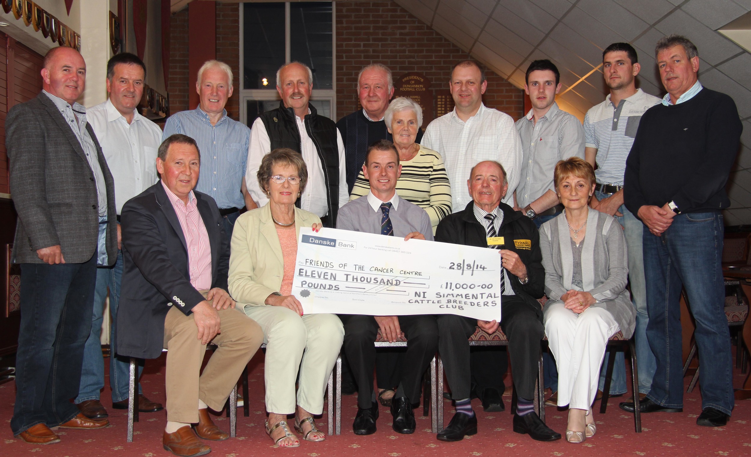 The NI Simmental Cattle Breeders' Club raised £11,000 for Friends of the Cancer Centre. The charity's trustees Jim Gamble and Avril Graham are pictrued receiving the cheque from Pat and Kathleen Kelly, and club chairman Richard Rodgers. Looking on are club committee members. Picture: Julie Hazelton