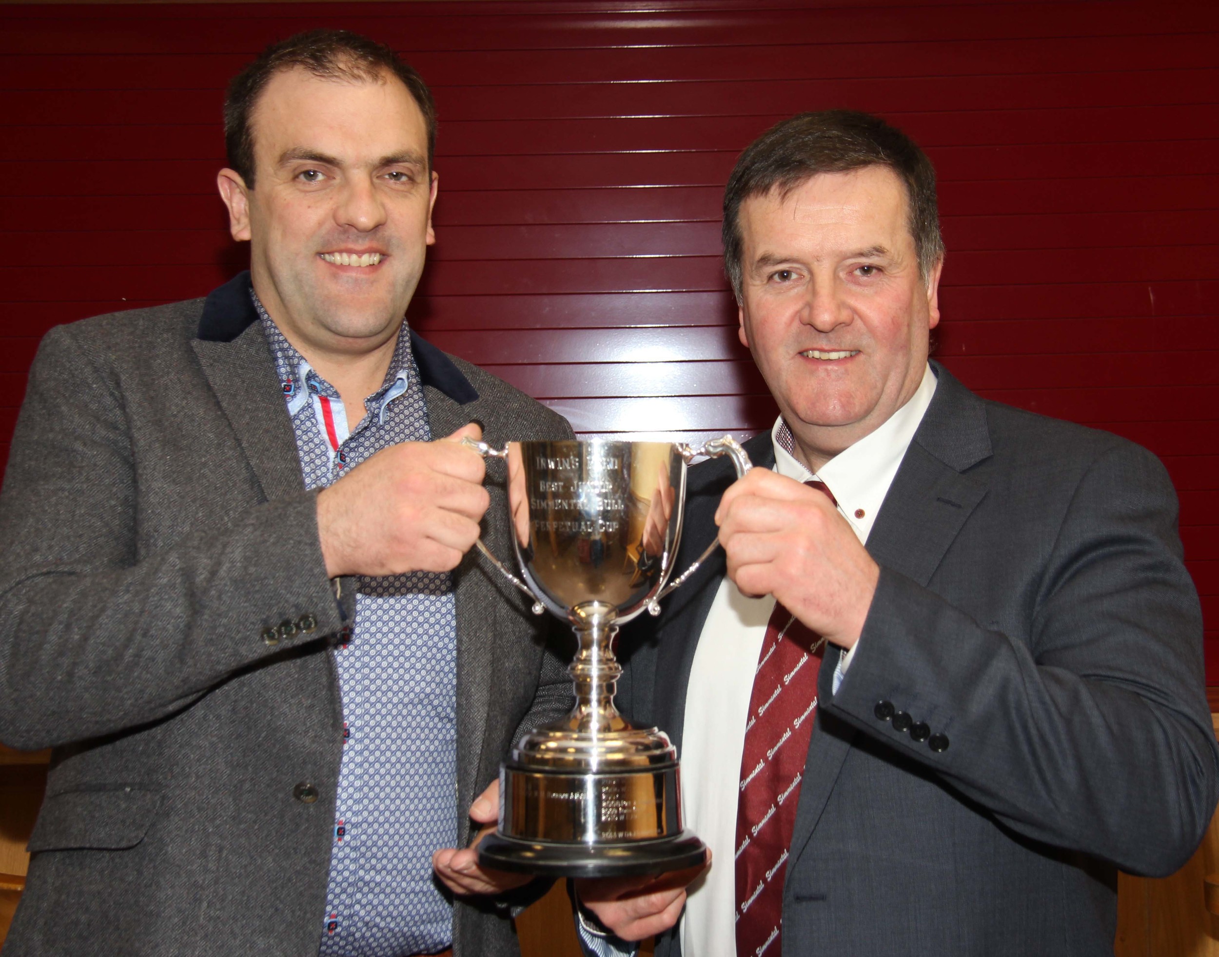 Robin Boyd receives the Irwins Feeds cup for the best junior bull at Clogher Show on behalf of Duncan McDowell, Newtownards, from sponsor Ian Cummins. 