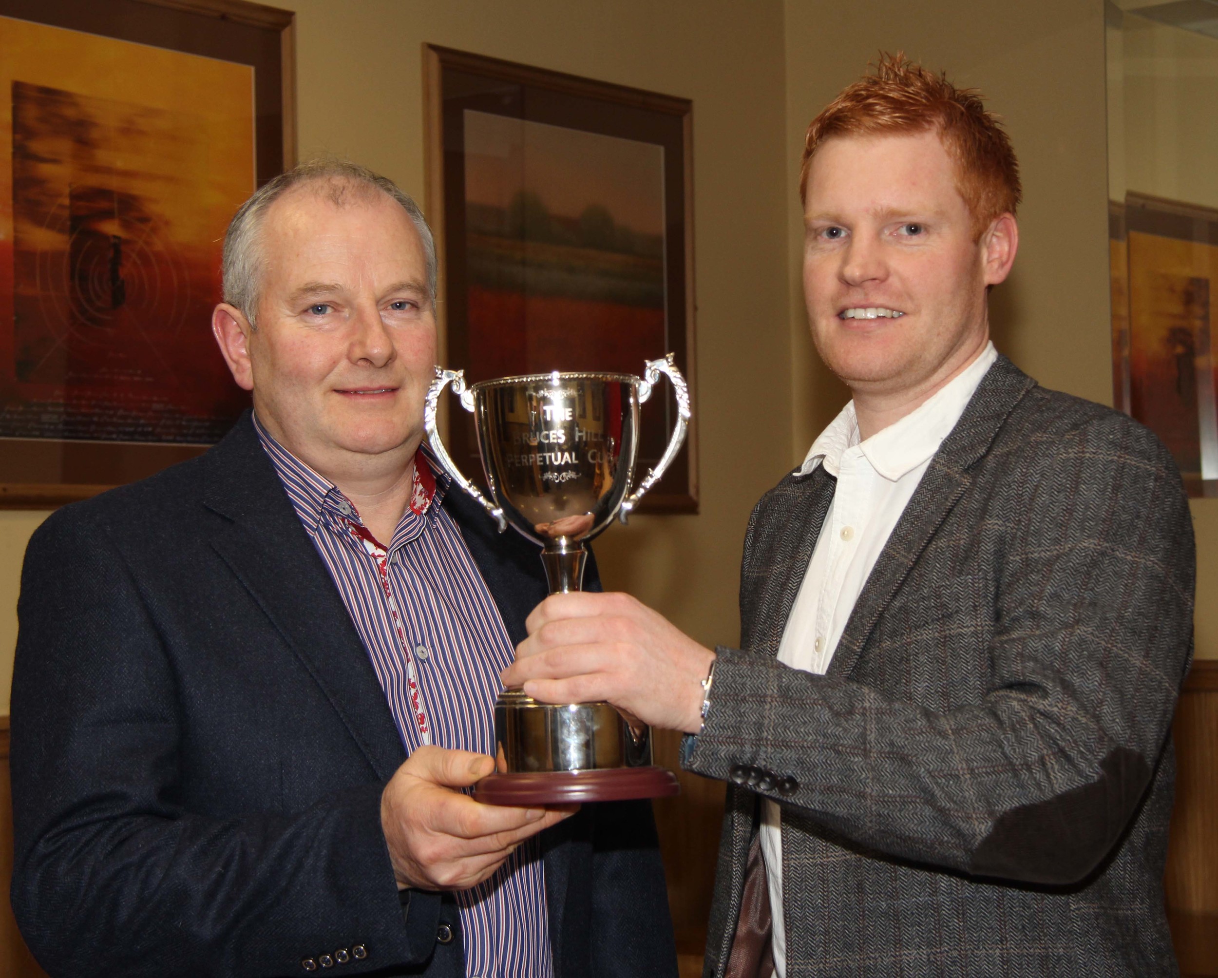 Francis Connon, Connon General Merchants, presents the trophy for the champion at the May show and sale to Christopher Weatherup, Ballyclare. 